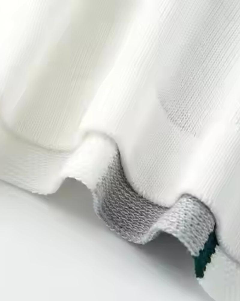 Dzianinowa koszulka polo z guzikami z przodu i pasiastym detalem